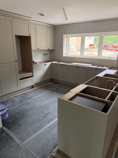 Shaker style kitchen being installed in 2 East Gate