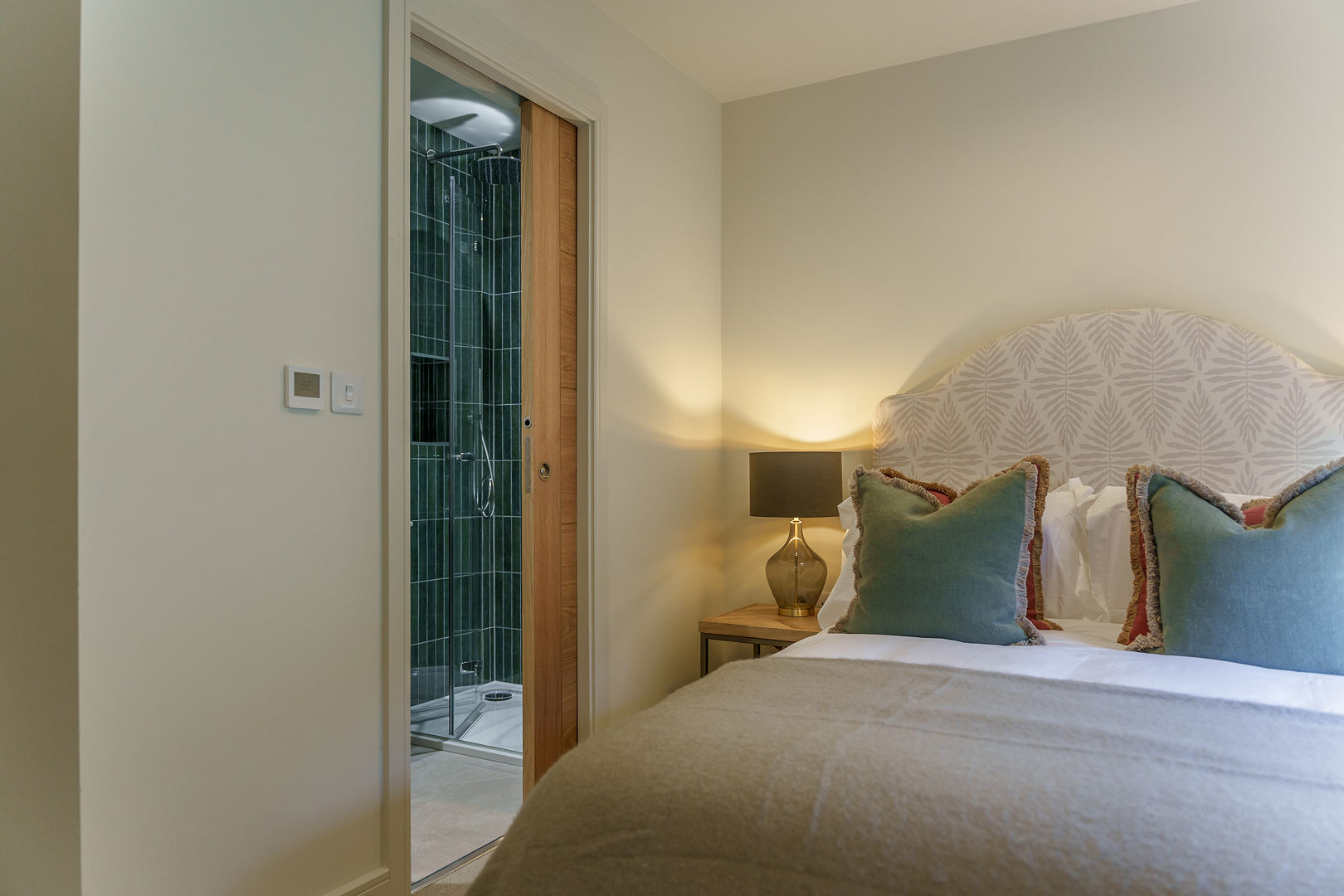 Bedroom 2 in our show home (plot 20) with view of en-suite with rain shower