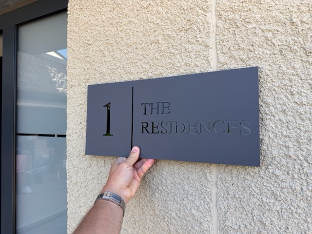 Making sure the postman knows where to go as he starts delivering letters to the new residents from Monday